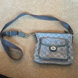 Coach grey purse. Little mark shown in picture but other than that brand new!
